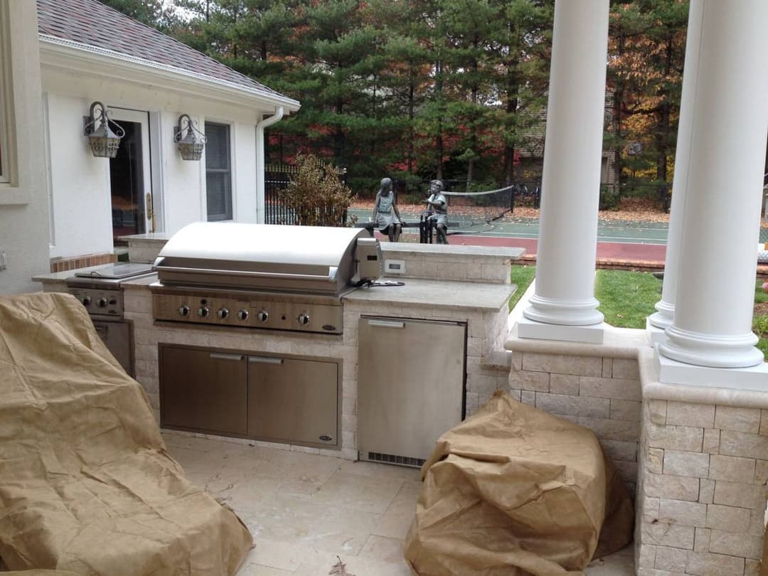 picture of a newly remodeled backyard deck with bbq and kitchen countertops